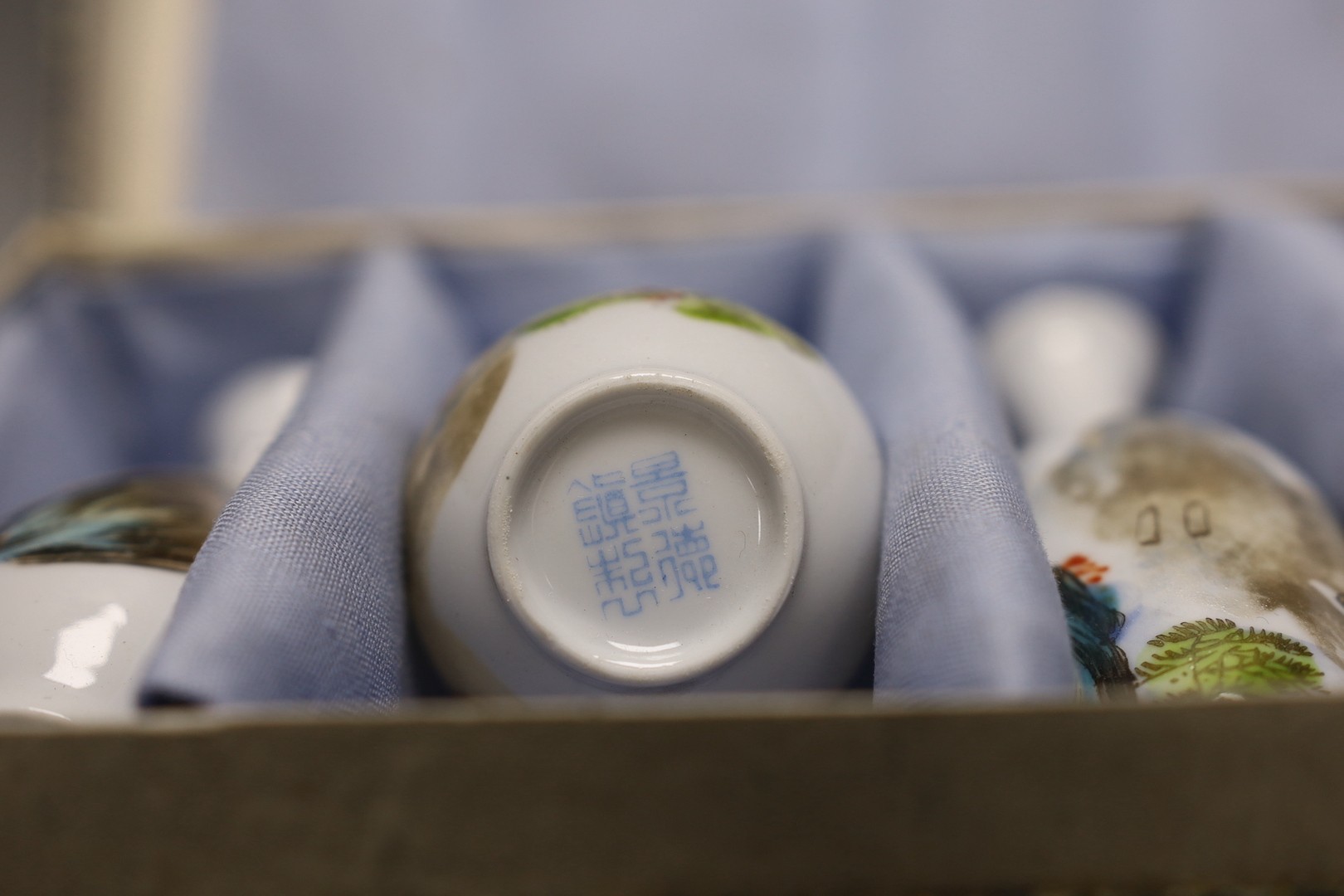 A Chinese blue and white miniature teapot, 6 matching cups and a tray and a box of five vases